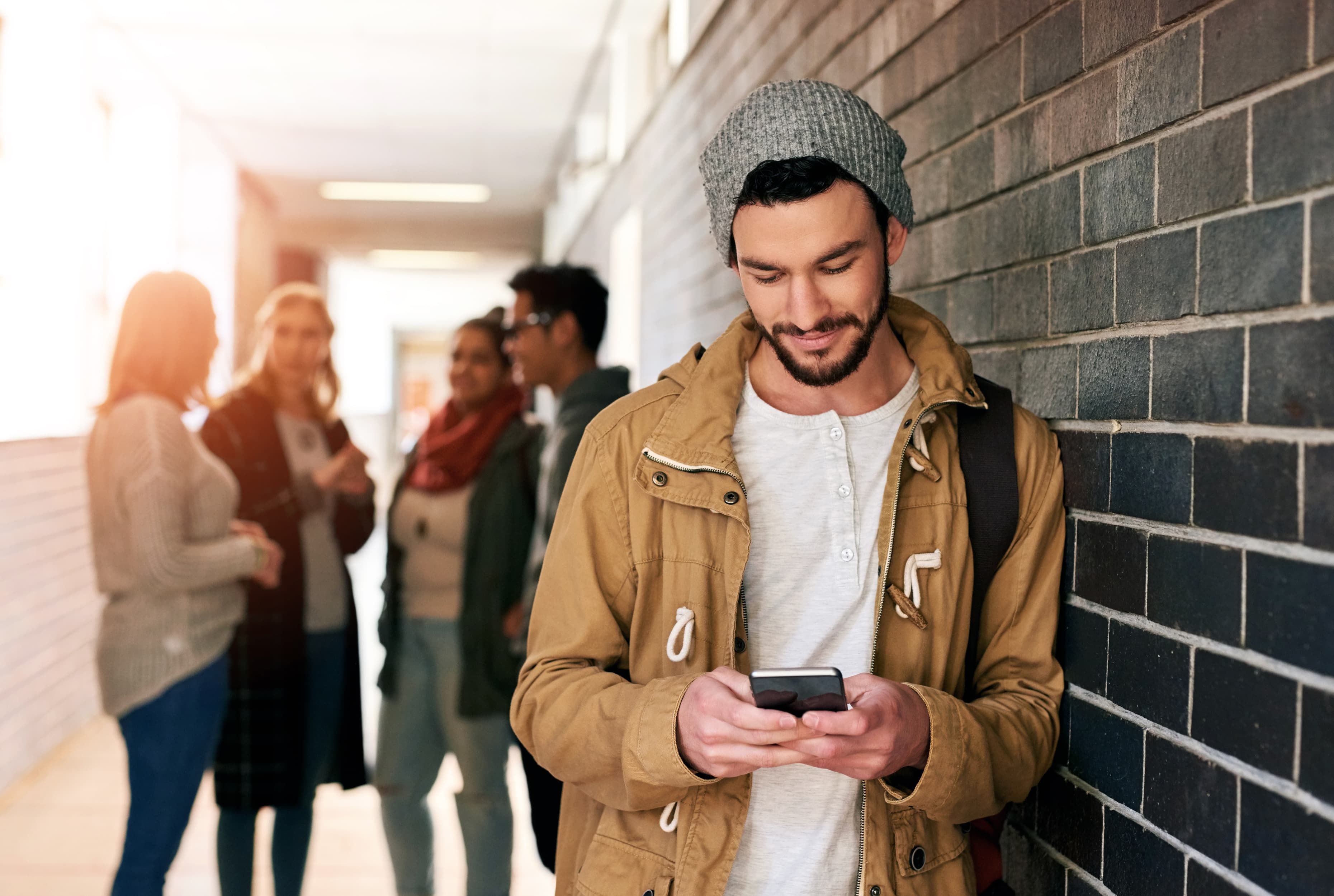 man with phone in hallway